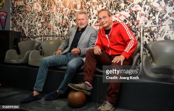 Football legend Paul Breitner and host Wigald Boning attend the preview screening of the new documentaries 'Deutschland - Deine Fussballseele' and...
