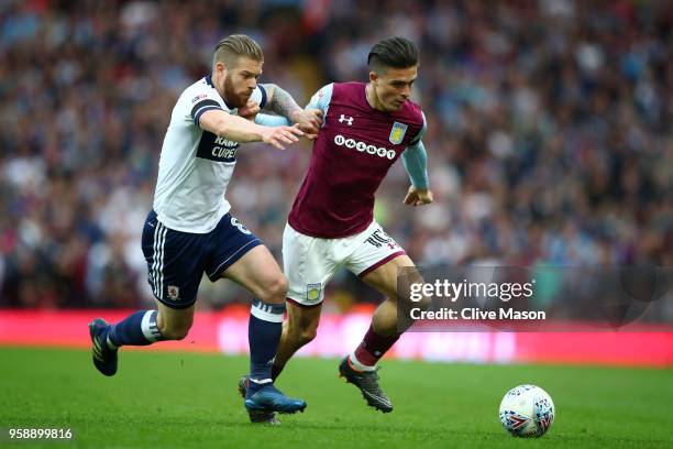 Adam Clayton of Middlesbrough battles for possession with Jack Grealish of Aston Villa during the Sky Bet Championship Play Off Semi Final second leg...