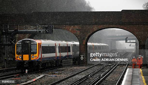 South-West train travels west through Winchfield Station, towards Basingstoke on January 20, 2010. AFP PHOTO / Adrian Dennis