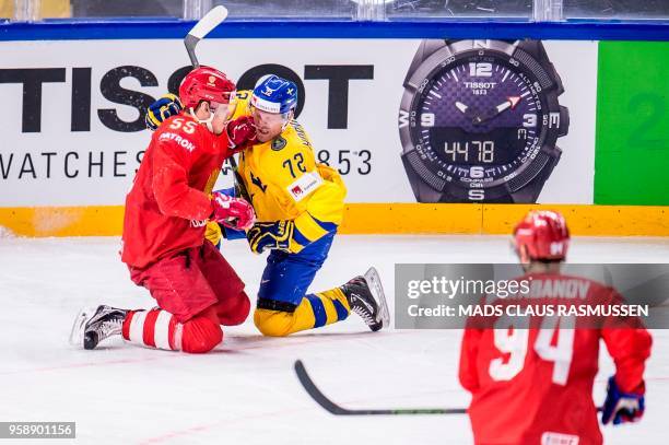 Bogdan Kiselevich of Russia and Patric Hornqvist of Sweden vie during the group A match Russia v Sweden of the 2018 IIHF Ice Hockey World...