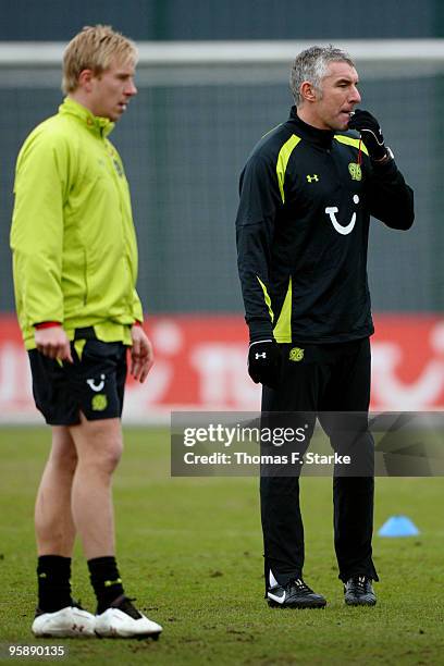 Head coach Mirko Slomka reacts while Mike Hanke looks on during the training of Hannover 96 at the training ground at the AWD Arena on January 20,...