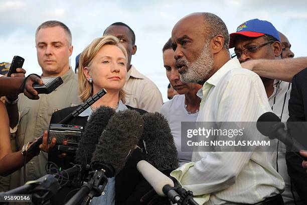 Haitian President Rene Preval speaks to the press with US Secretary of State Hillary Clinton after their meeting at Port-au-Prince's Toussaint...