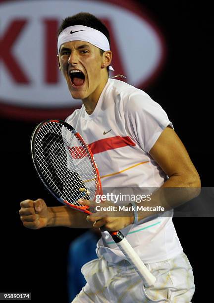 Bernard Tomic of Australia celebrates winning the third set in his second round match against Marin Cilic of Croatia during day three of the 2010...