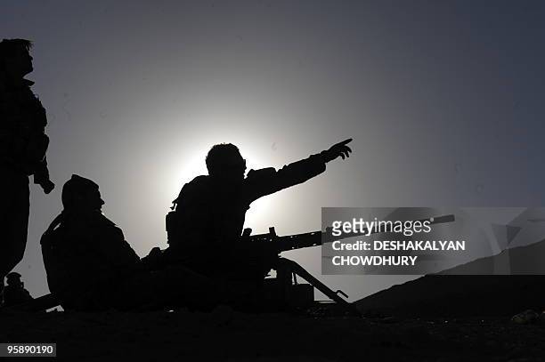 Australian soldiers of the Omlet-c Company fix their target prior to practice firing at their forward operating base in southern Uruzgan province's...