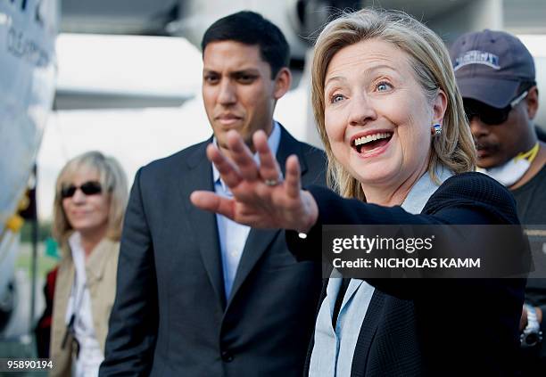 Secretary of State Hillary Clinton wave as she arrives at Port-au-Proince Toussaint Louverture International Airport on January 16 four days after an...