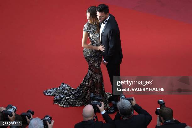 French-Swiss model Nabilla Benattia and her partner Thomas Vergara pose as they arrive on May 15, 2018 for the screening of the film "Solo : A Star...