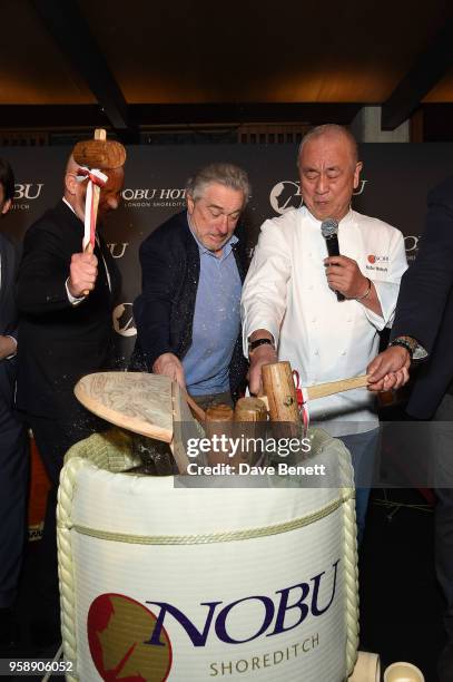 Trevor Horwell Robert De Niro and Nobu Matsuhisa break open a sake barrel to celebrate the Nobu Hotel London Shoreditch official launch event on May...