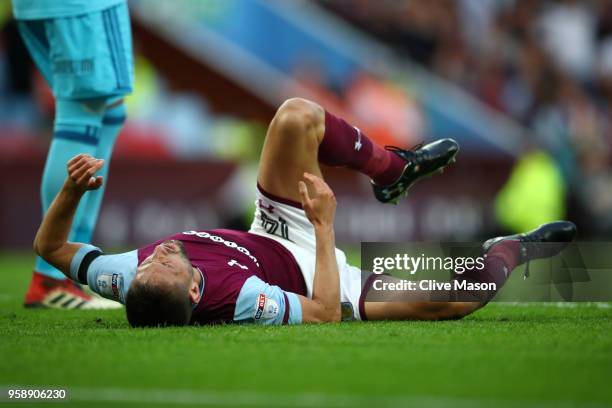 Conor Hourihane of Aston Villa goes down injured during the Sky Bet Championship Play Off Semi Final second leg match between Aston Villa and...