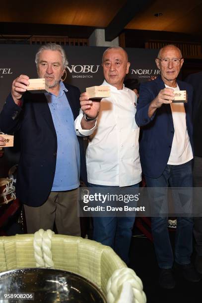Robert De Niro, Nobu Matsuhisa and Meir Teper raise a toast at the Nobu Hotel London Shoreditch official launch event on May 15, 2018 in London,...