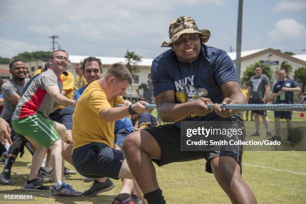 Culinary Specialist 2nd Class Courtney Riddle and his colleagues at tug-o-war event at the All-Navy Captain's Cup, Okinawa, Japan, May 11, 2018....