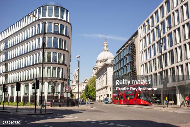london traffic flowing through cannon st on a sunny saturday morning in the city of london. st paul’s cathedral is in the background. - st paul's cathedral london stock pictures, royalty-free photos & images