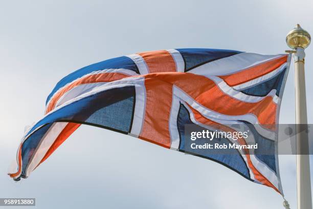 windy of british flag - flagship stock pictures, royalty-free photos & images