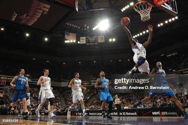 Tyreke Evans of the Sacramento Kings lays up a shot against Rashard Lewis of the Orlando Magic during the game on January 12, 2010 at Arco Arena in...