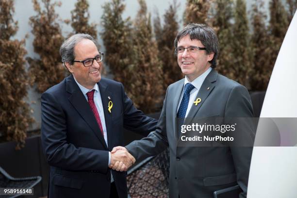 New elected and former Catalan Prime Minister Qim Torra and Carles Puigdemont chat prior to a press conference in Berlin, Germany on May 15, 2018.