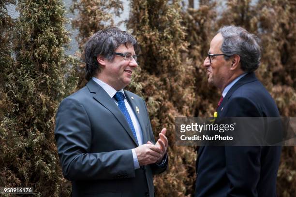 New elected and former Catalan Prime Minister Qim Torra and Carles Puigdemont chat prior to a press conference in Berlin, Germany on May 15, 2018.