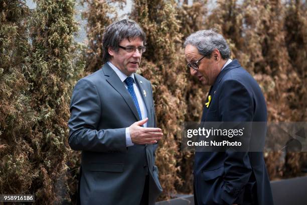 New elected and former Catalan Prime Minister Qim Torra and Carles Puigdemont chat prior to a press conference in Berlin, Germany on May 15, 2018.