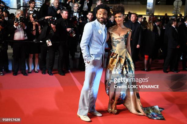British actress Thandie Newton and US actor Donald Glover pose as they leave the Festival Palace on May 15, 2018 after the screening of the film...