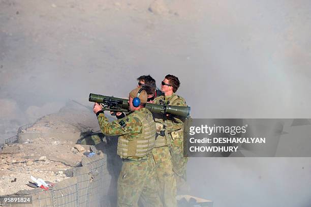 Australian soldierS of Omlet-c company launch a rocket during practice firing at the forward operating base in southern Uruzgan province's Mirwais on...