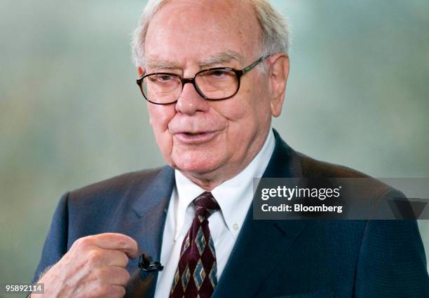 Warren Buffett, chairman and chief executive officer of Berkshire Hathaway Inc., speaks to members of the media before a special shareholders meeting...