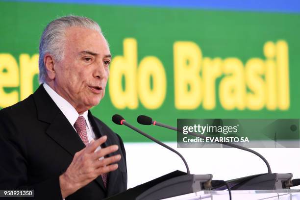 Brazilian President Michel Temer delivers a speech during a ceremony celebrating two years in government at the Planalto Palace in Brasilia on May...