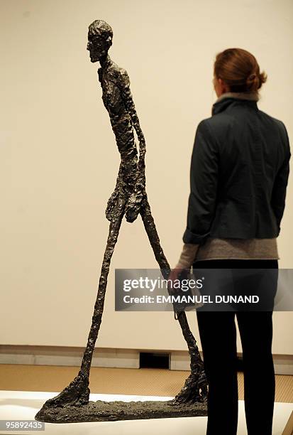 Homme qui marche I", a sculpture by artist Alberto Giacometti, is on display at Sotheby's during a preview at Sotheby's,on January 20 in New York....