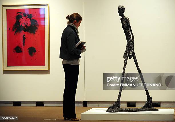 Homme qui marche I", a sculpture by artist Alberto Giacometti, is on display at Sotheby's during a preview at Sotheby's, on January 20 in New York....