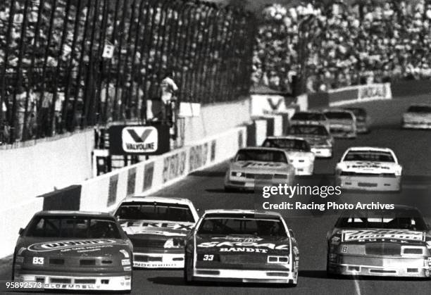 Lake Speed races by in first place ahead of Morgan Shepherd, Bobby Hillin Jr., Alan Kulwicki, Darrell Waltrip and the rest of the pack at the...