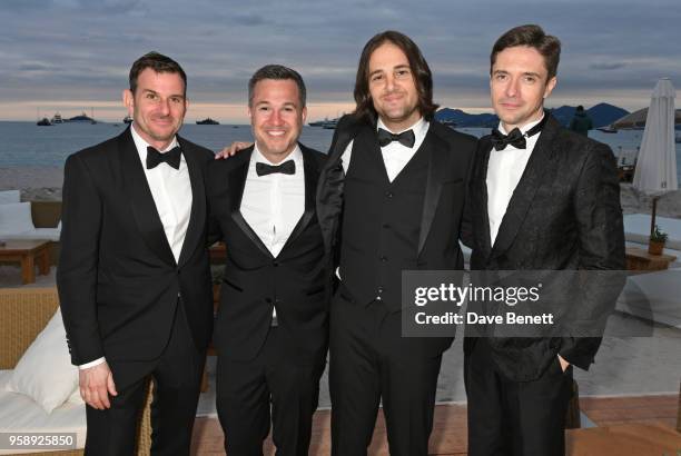 Chris Bender, Jake Weiner, David Robert Mitchell and Topher Grace pose at Nikki Beach for the "Under The Silver Lake" dinner presented by...