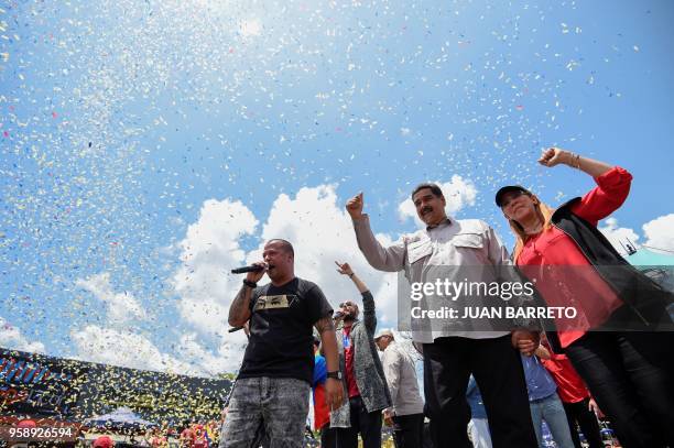 Venezuelan President and presidential candidate Nicolas Maduro and his wife Cilia Flores attend a rally in Charallave, 64km southeast from Caracas on...