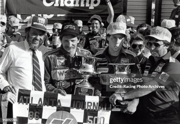 Dale Earnhardt celebrates in victory lane with his wife and car owner Richard Childress. Earnhardt would win the Atlanta Journal 500 and take on home...