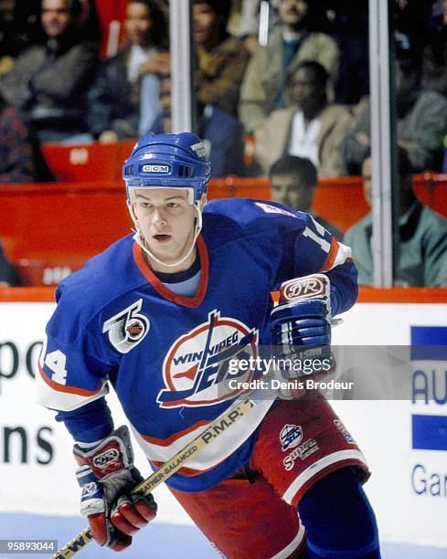 Stu Barnes of the Winnipeg Jets skates against the Montreal Canadiens in the early 1990's at the Montreal Forum in Montreal, Quebec, Canada.