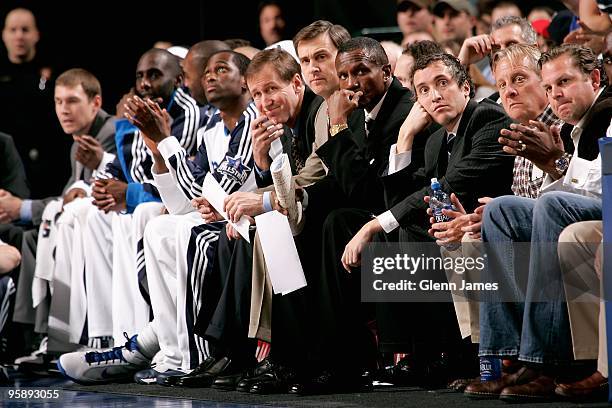 Assistant coach Terry Stotts, head coach Rick Carlisle and assistant coach Dwane Casey of the Dallas Mavericks sit on the bench during the game...