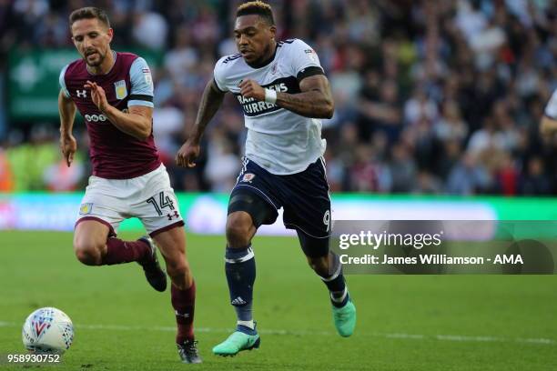 Conor Hourihane of Aston Villa and Britt Assombalonga of Middlesbrough during the Sky Bet Championship Play Off Semi Final:Second Leg match between...