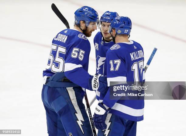 Braydon Coburn of the Tampa Bay Lightning talks with teammates Yanni Gourde and Alex Killorn during the second period in Game Two of the Eastern...