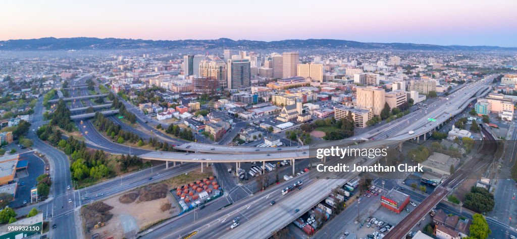 Aerial: Oakland City Skyline at sunset. California, USA