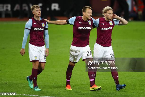 James Bree of Aston Villa , John Terry of Aston Villa and Birkir Bjarnason of Aston Villa celebrate at the full time whistle during the Sky Bet...