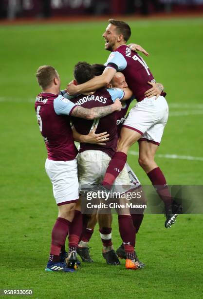 Robert Snodgrass of Aston Villa celebrates with teammates Glenn Whelan of Aston Villa and Conor Hourihane of Aston Villa at the full time whistle...