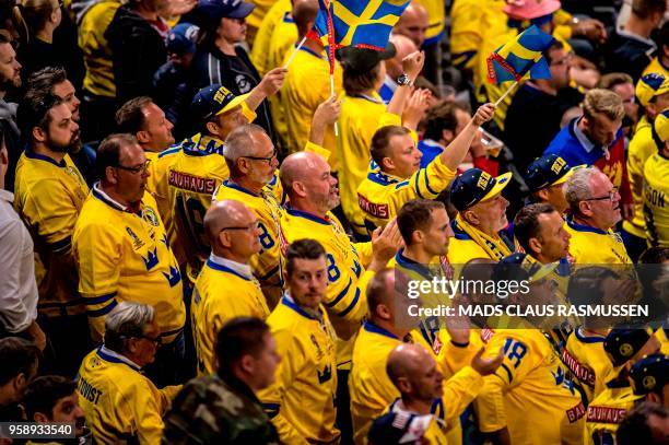 Fans from Sweden cheer during the IIHF World Championship group A ice hockey match between Russia and Sweden in Royal Arena in Copenhagen, on May 15,...