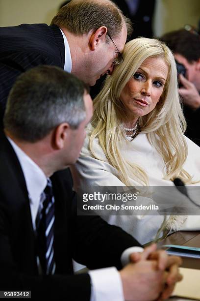 Michaele Salahi listens to her lawyer Stephen Best as she and her husband Tareq Salahi prepare to testify to the House Homeland Security Committee...