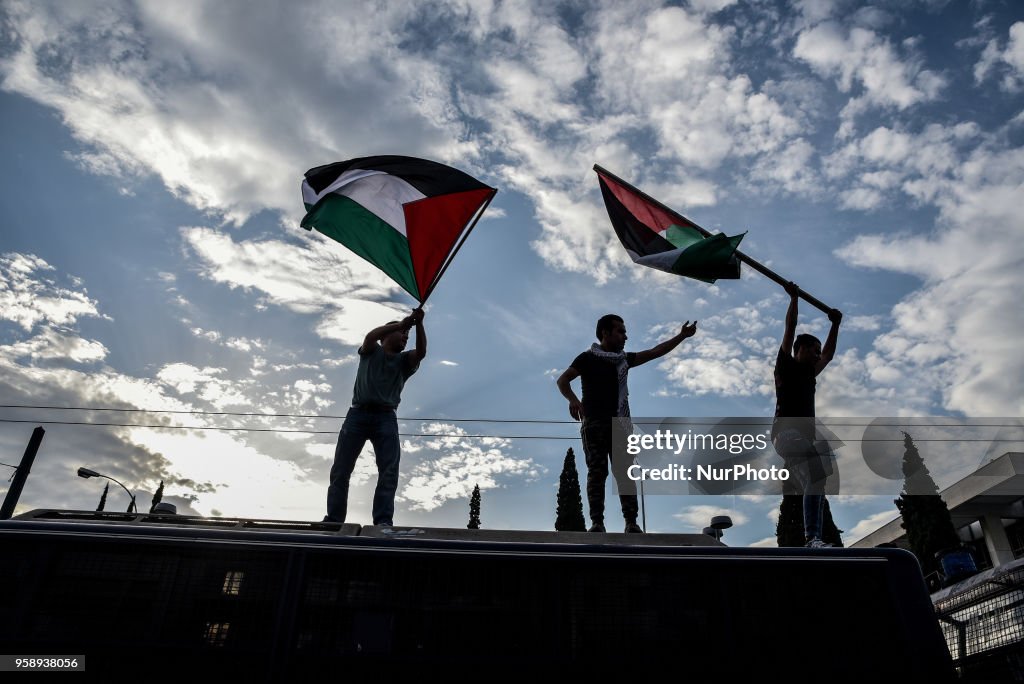 Palestinians demonstrate outside the embassy of Israel in Athens
