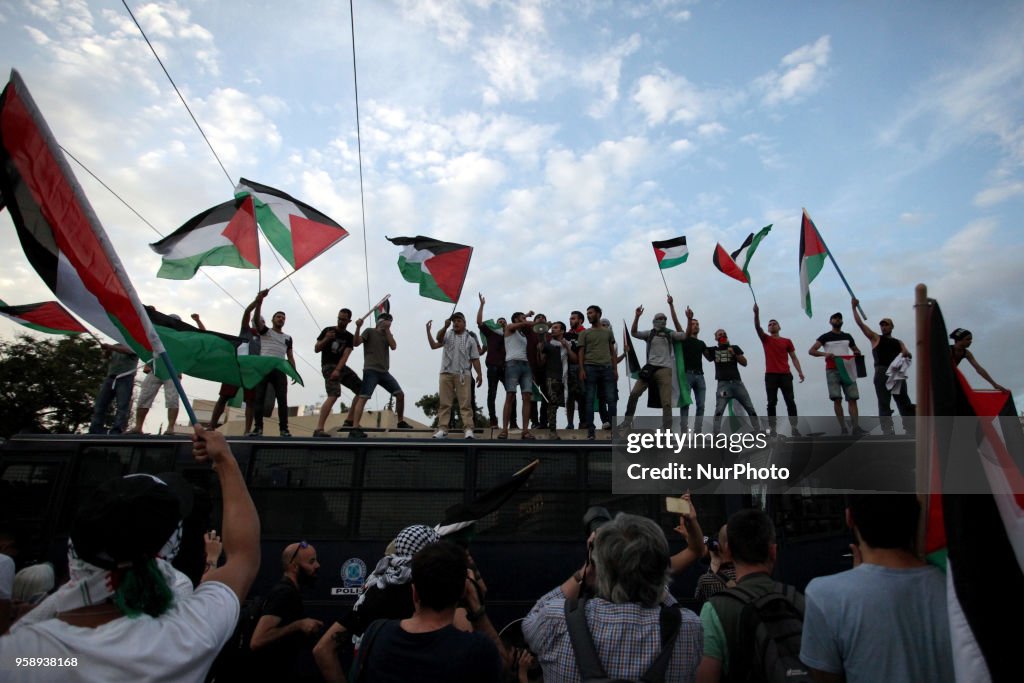 Palestinians demonstrate outside the embassy of Israel in Athens