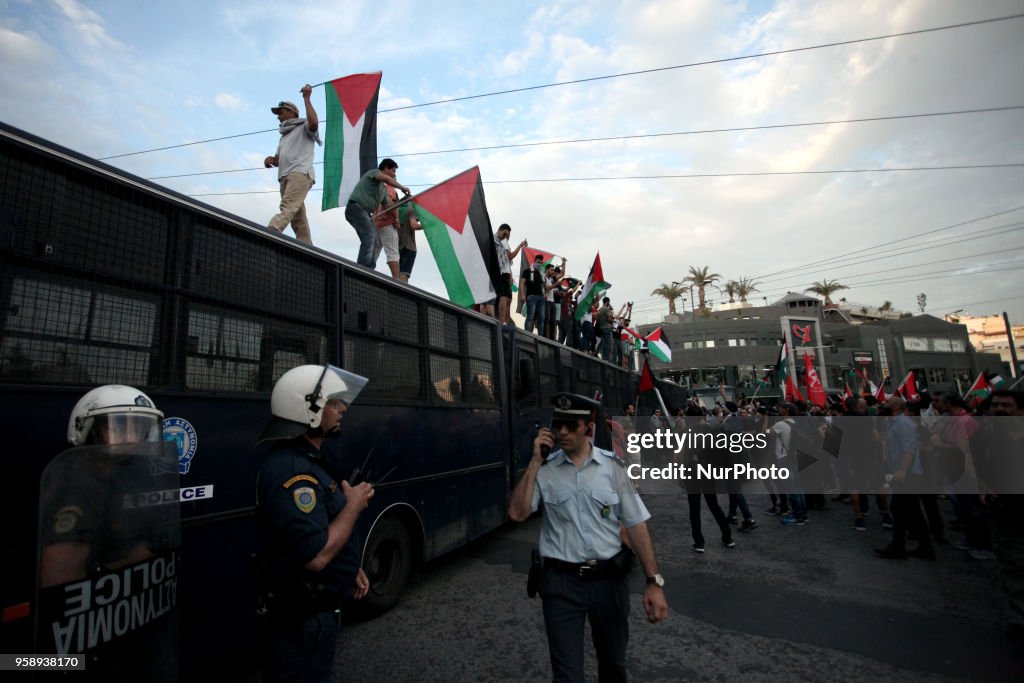 Palestinians demonstrate outside the embassy of Israel in Athens