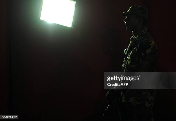 Sri Lankan special forces commandos stands guard as supporters of the main opposition presidential candidate and former army chief General Sarath...