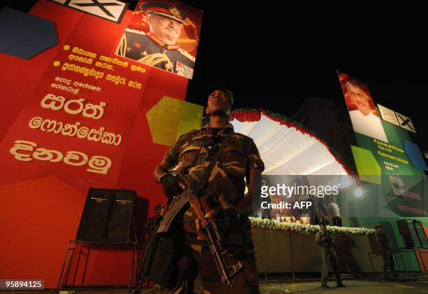Sri Lankan special forces commando stands guard as supporters of the main opposition presidential candidate and former army chief General Sarath...