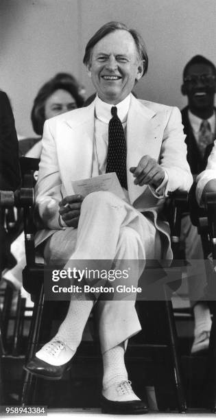 Author Tom Wolfe, attending Harvard University's Class Day as speaker, smiles during a presentation in Harvard Yard in Cambridge, MA on June 8, 1988.