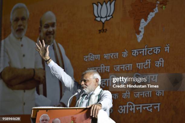 Prime Minister Narendra Modi gestures while addressing party workers at the party headquarters after BJP emerged as the single largest party in...