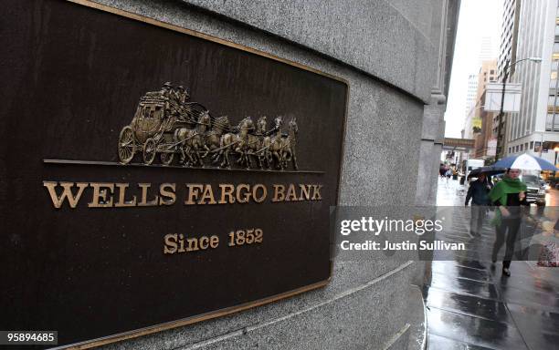 Pedestrians walk by a Wells Fargo Bank branch office January 20, 2010 in San Francisco, California. Wells Fargo beat analyst expectations by posting...