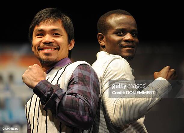 World champion boxer Manny �PacMan� Pacquiao , and former world welterweight champion and current No. 1 contender Joshua Clottey pose for pictures...