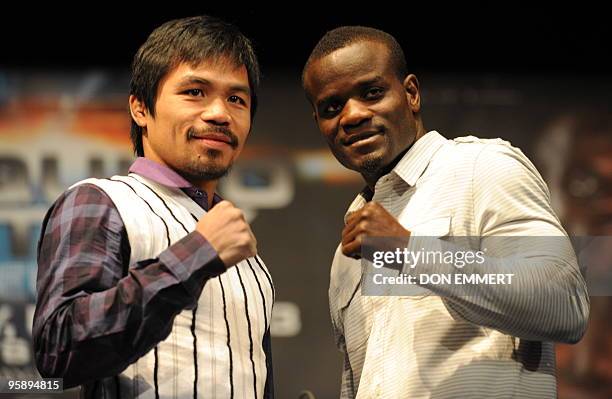 World champion boxer Manny �PacMan� Pacquiao , and former world welterweight champion and current No. 1 contender Joshua Clottey pose for pictures...