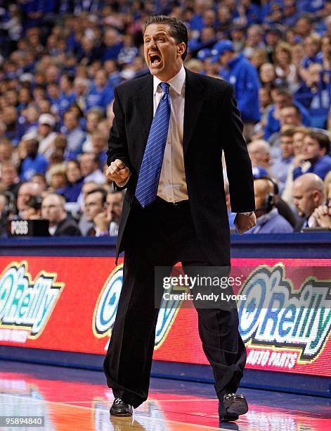 John Calipari the Head Coach of the Kentucky Wildcats gives instructions to his team during the game against the Hartford Hawks at Rupp Arena on...